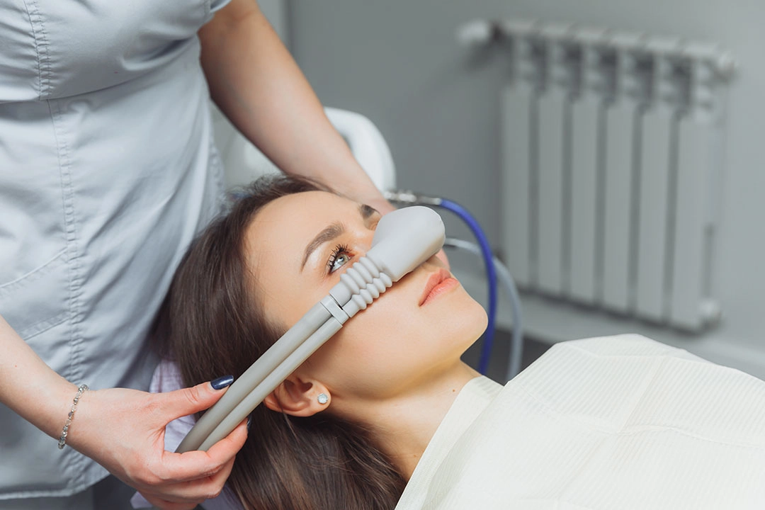 Patient receives nitrous oxide sedation during dental treatment